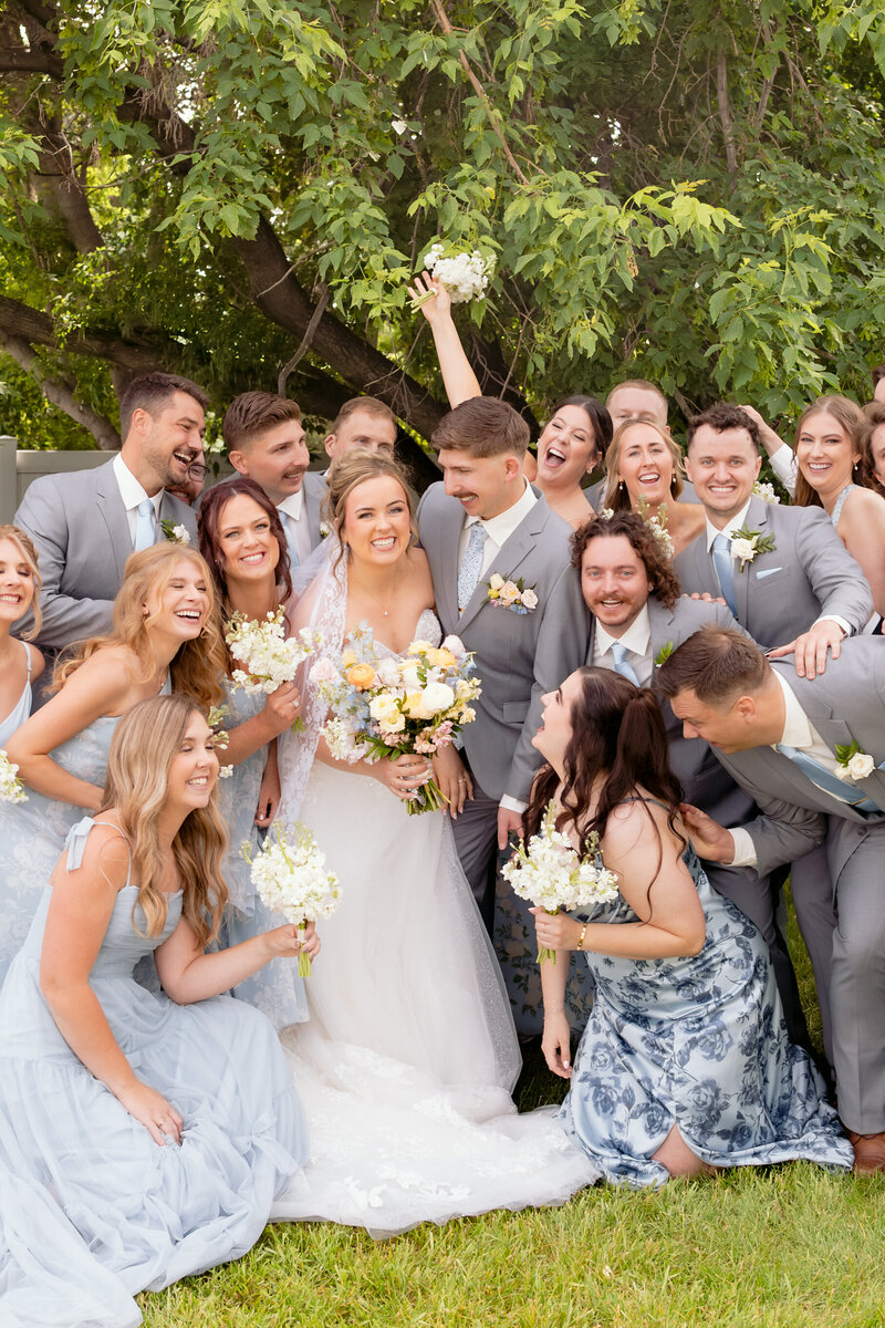 A fun bridal party celebrating the bride and groom at The Pines Venue in Davenport, Photographed by K.Ranae Photography.