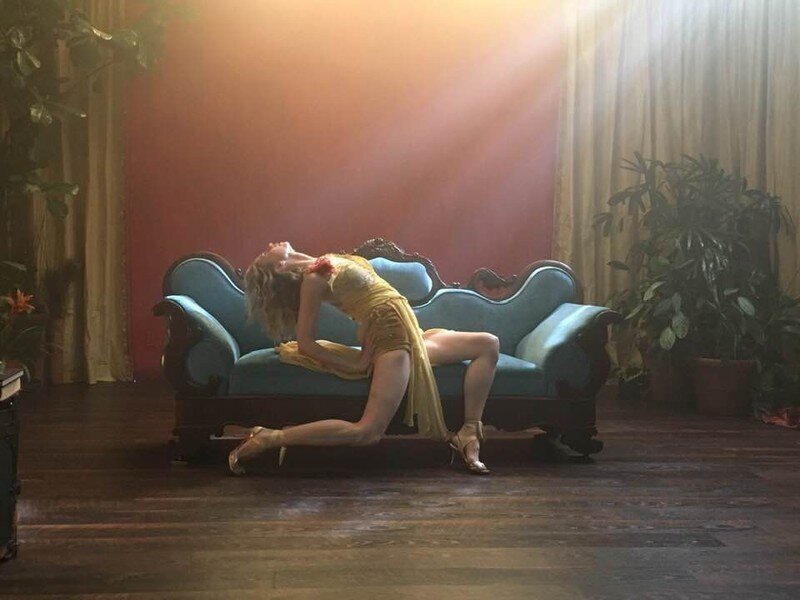 Woman dances on couch