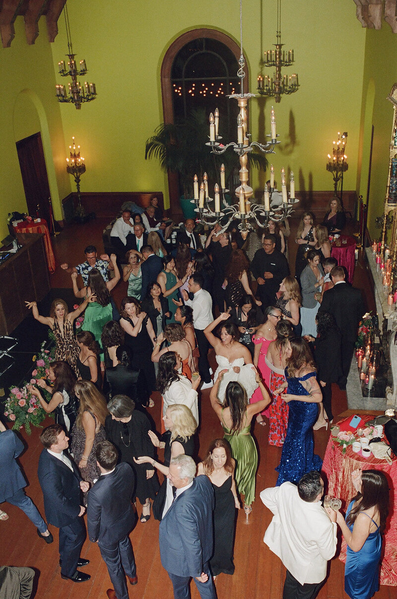 LGBTQ Brides and their Guests are dancing in the colorful ballroom at The Paramour Estate.