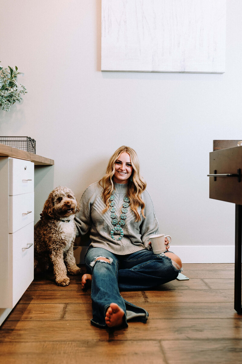 girl in office with aussiedoodle dog and turquoise jewelry
