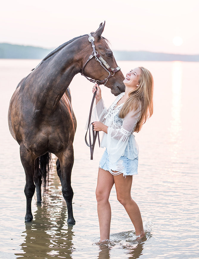 Girl and horse in the water