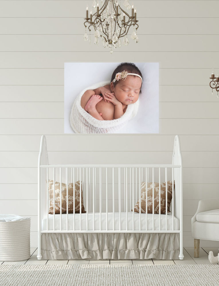 newborn portrait above crib