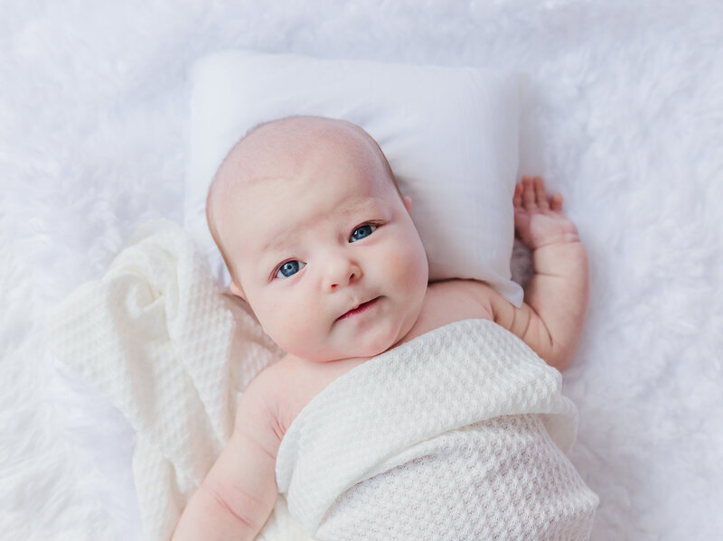 Newborn baby with pink headband