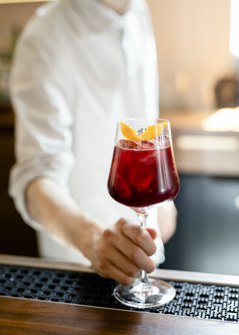bartender holding wine