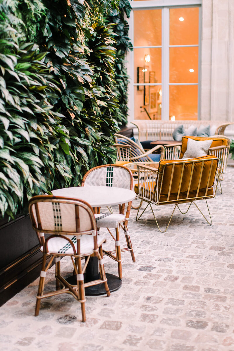Outdoor Cafe with Green Leaved Wall & French Bistro Chairs - Brenda Chadambura
