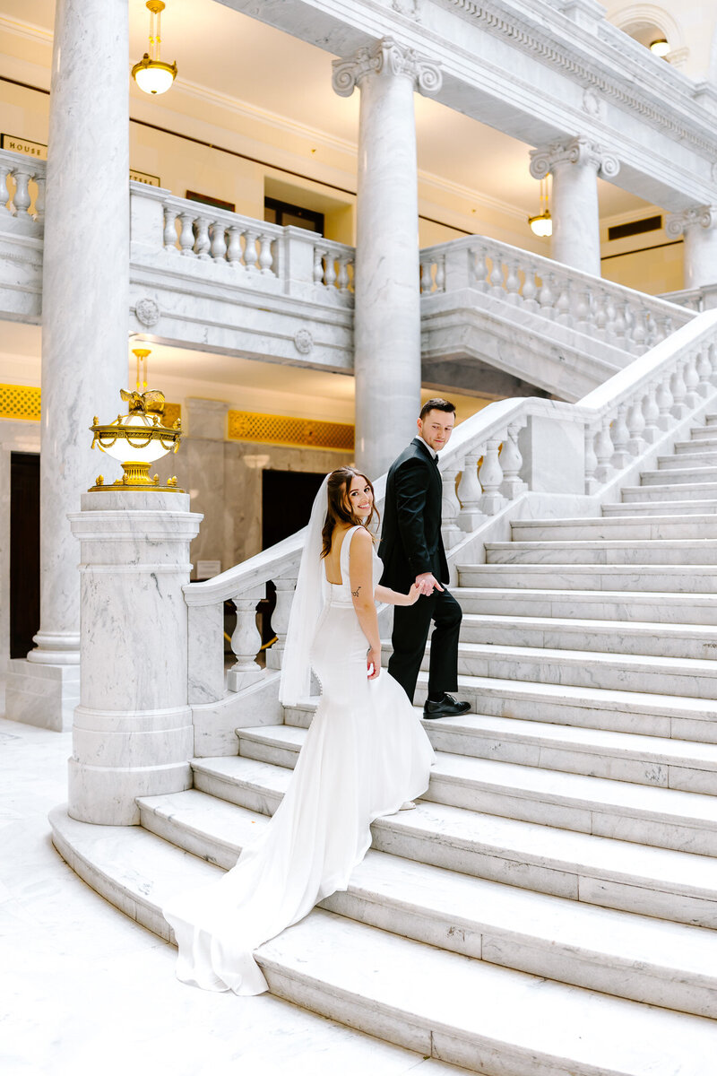 Experience this romantic Salt Lake City elopement featuring a stunning first look at the Utah State Capitol and emotional private vows in the snowy woods of Tibble Fork. A dreamy winter wedding captured with timeless elegance and cinematic detail.