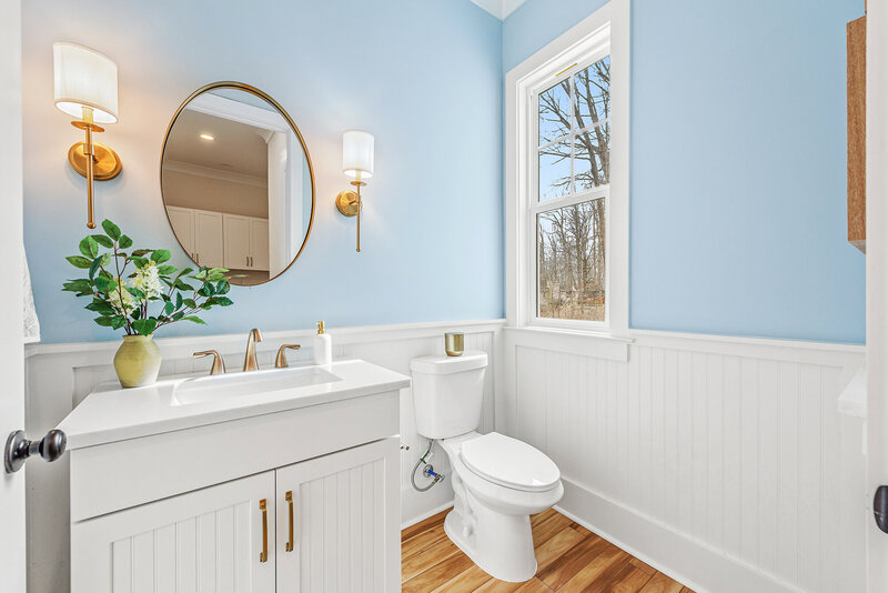 blue bathroom design. A residential new construction project in which Gracious Home Interiors designed and staged a new construction home in Mint Hill, NC, with Bridwell Homes.