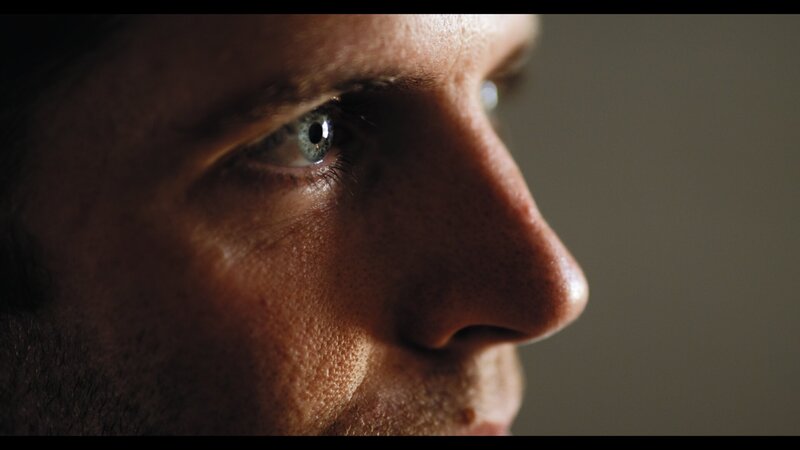 Detailed close-up of male actor during cinematic video production and brand storytelling project
