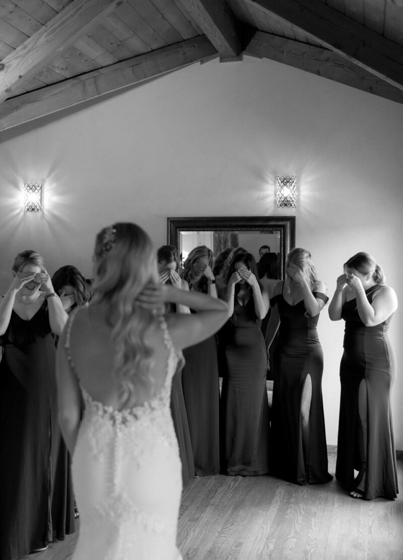 Black and white photo f the bride's maid's first look