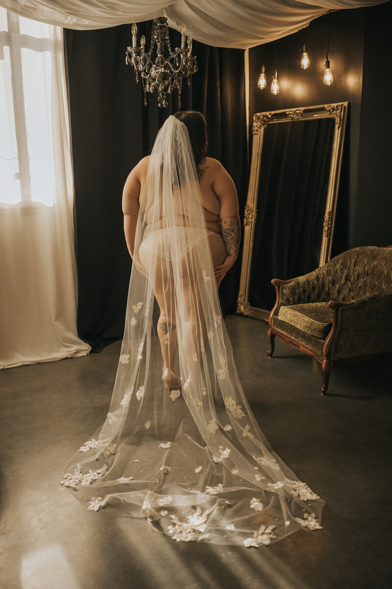 future bride doing a boudoir photoshoot as a wedding gift for her spouse