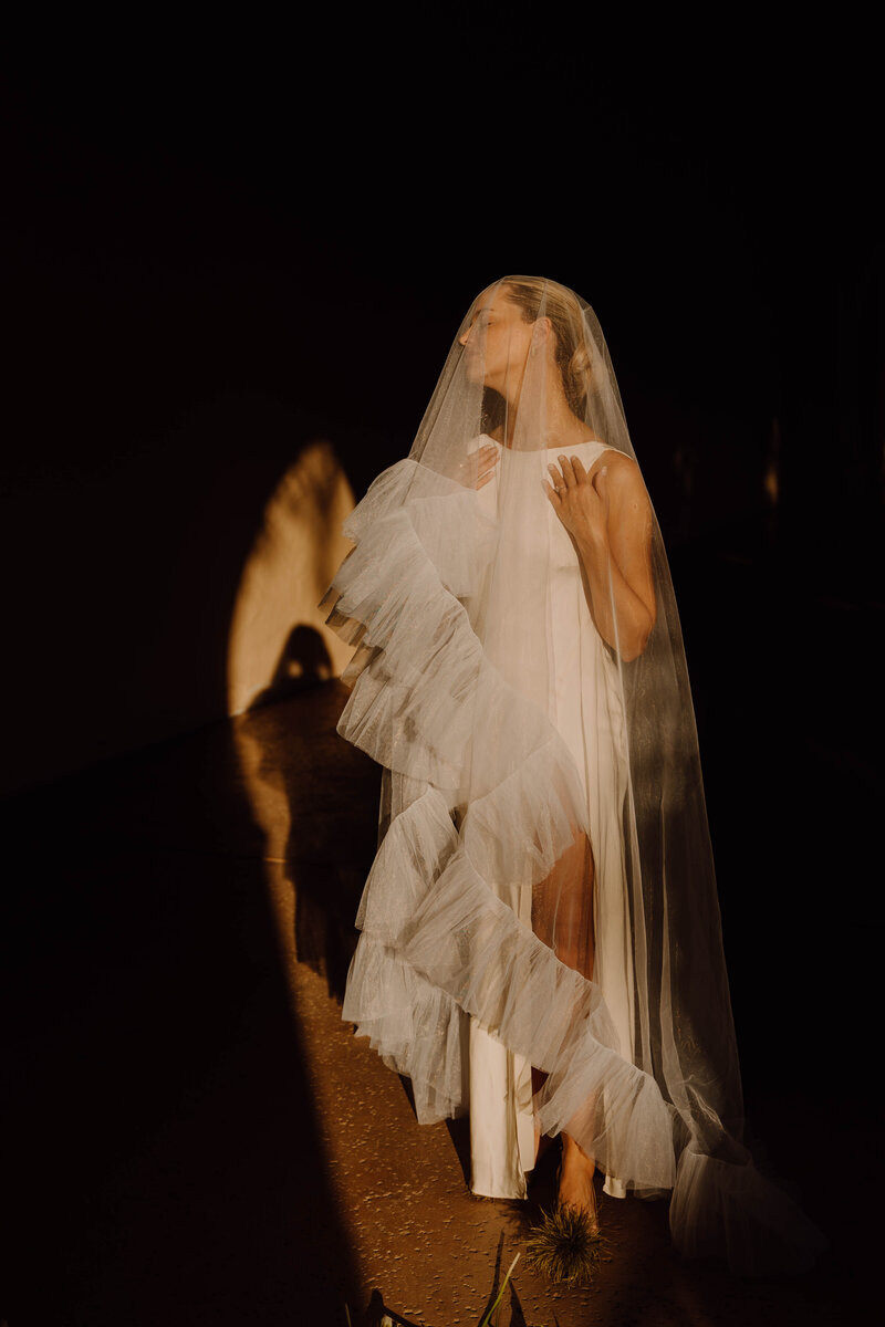 bride with a veil over her body