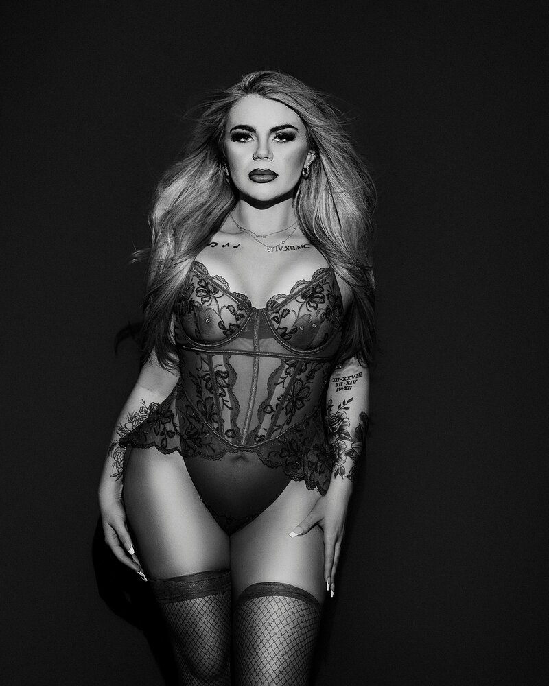 Black and white boudoir portrait of confident woman in Austin
