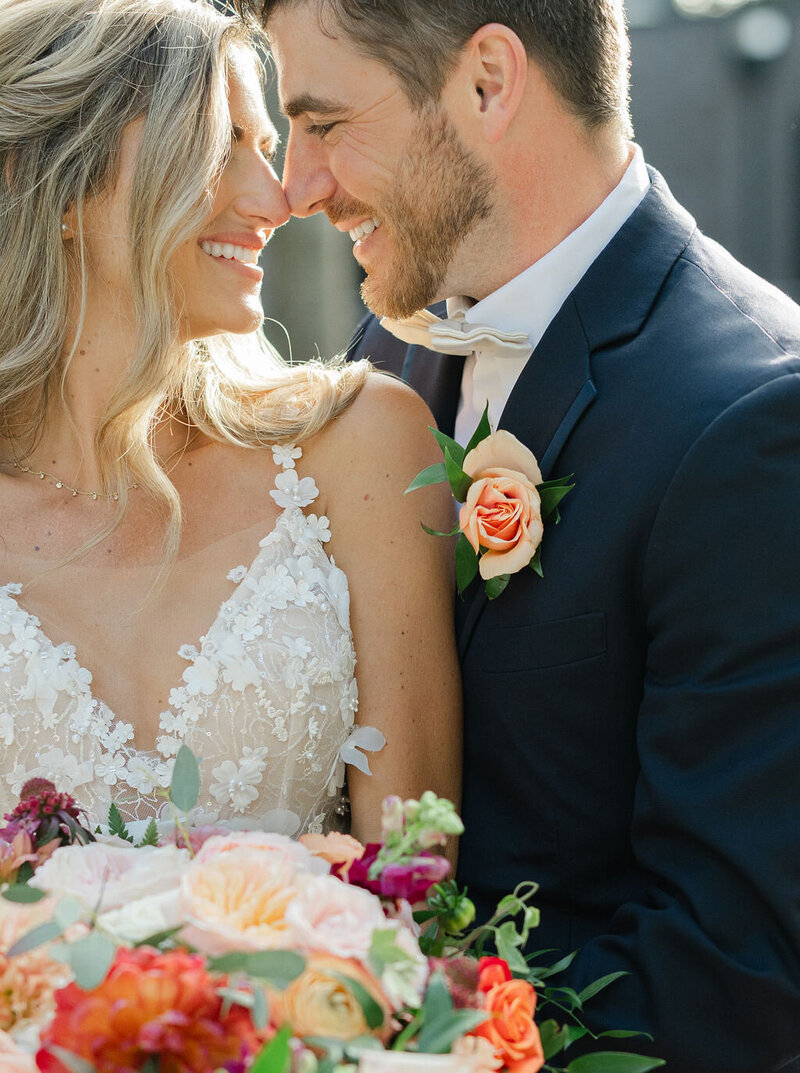 Bride and Groom snuggle and smile