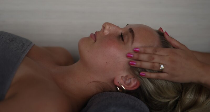 woman receiving massage at a spa