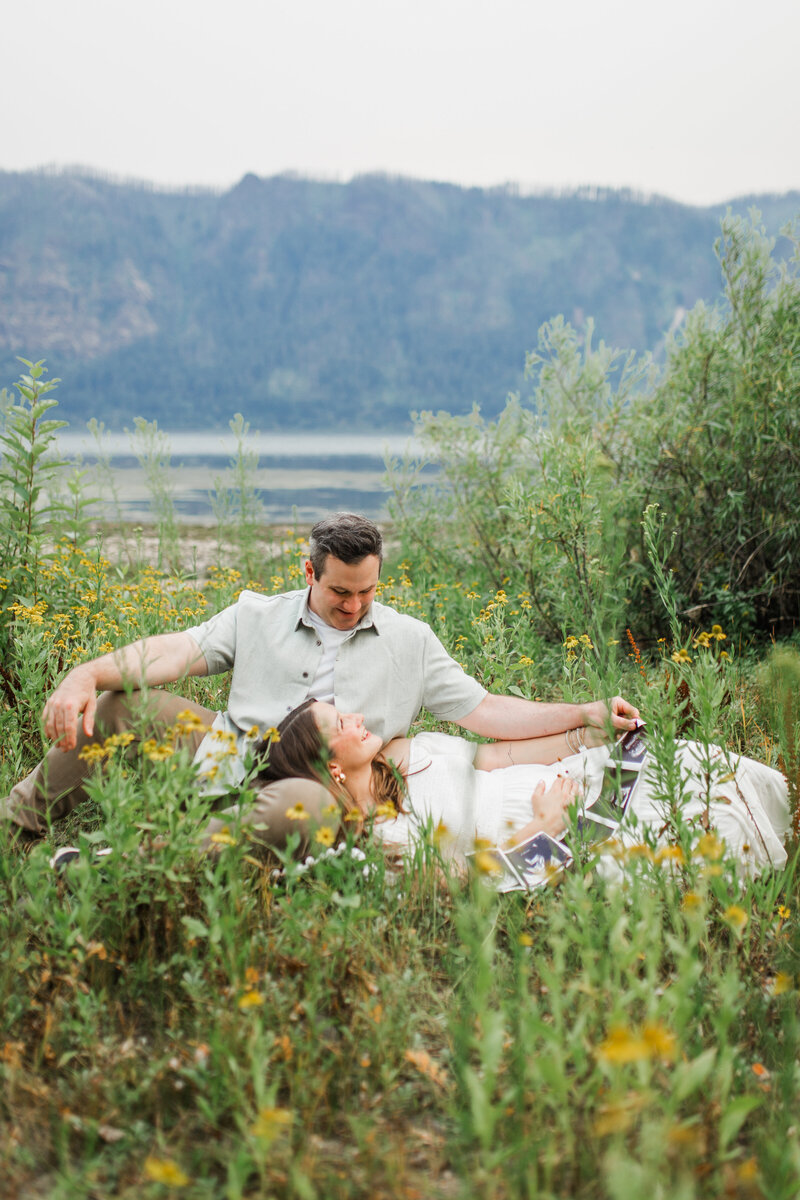 A couple sits along the beautiful Columbia River Gorge. Taken by Vancouver, Washington family photographer.