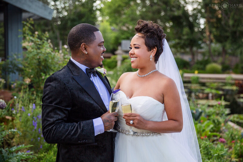 Couple toast at their Water Garden Gazebo wedding at Denver Botanic Gardens