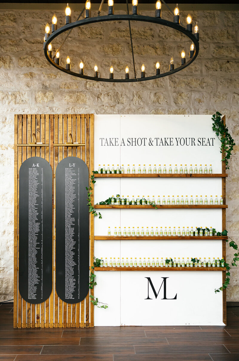 Close-up of Mexican-inspired wedding place setting with blue and white Talavera-style plate, custom die-cut menu, and woven charger, styled by Eventive Designs.