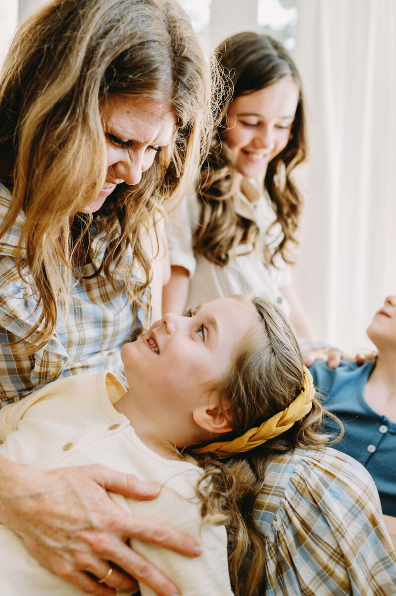 mom with daughter on her lap