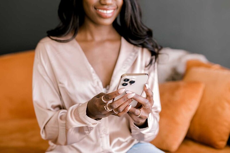 Brand Strategist writing brand story bio using phone