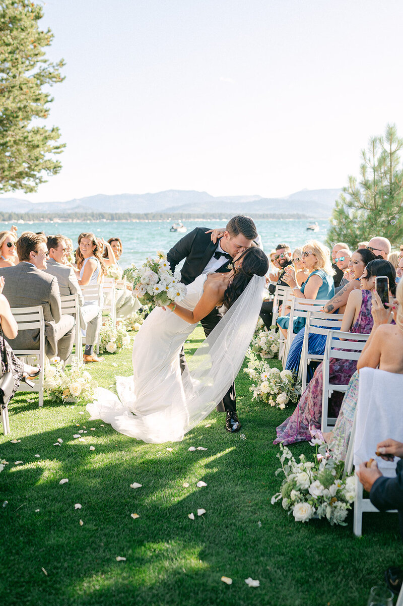 Bride and Groom kiss after their wedding ceremony at Edgewood Resort in Lake Tahoe.