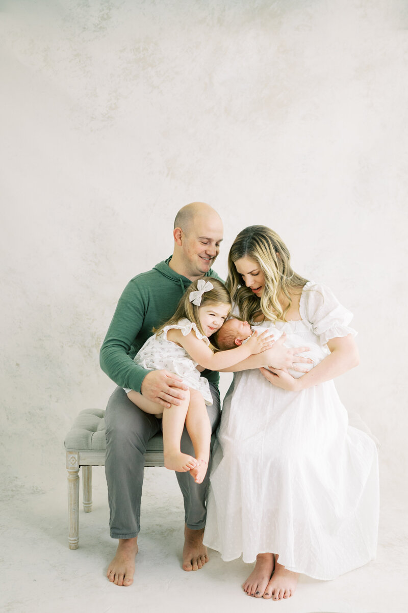 Mother father sister and newborn baby in a Nashville photography session