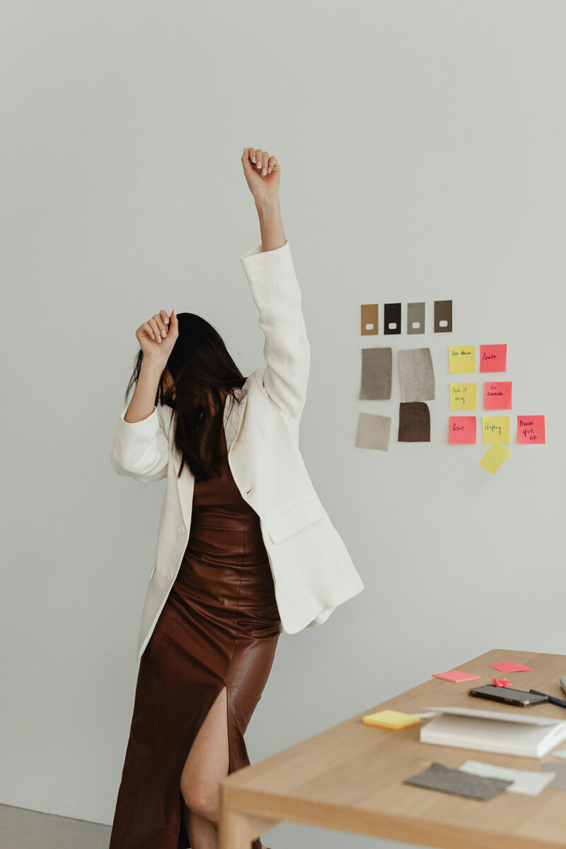 Woman dancing after a successful business