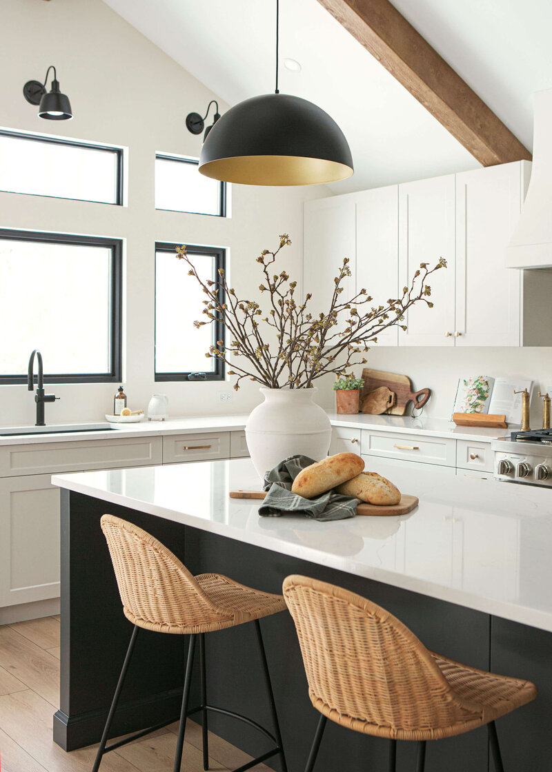 transitional modern kitchen  with large island wicker counter stools