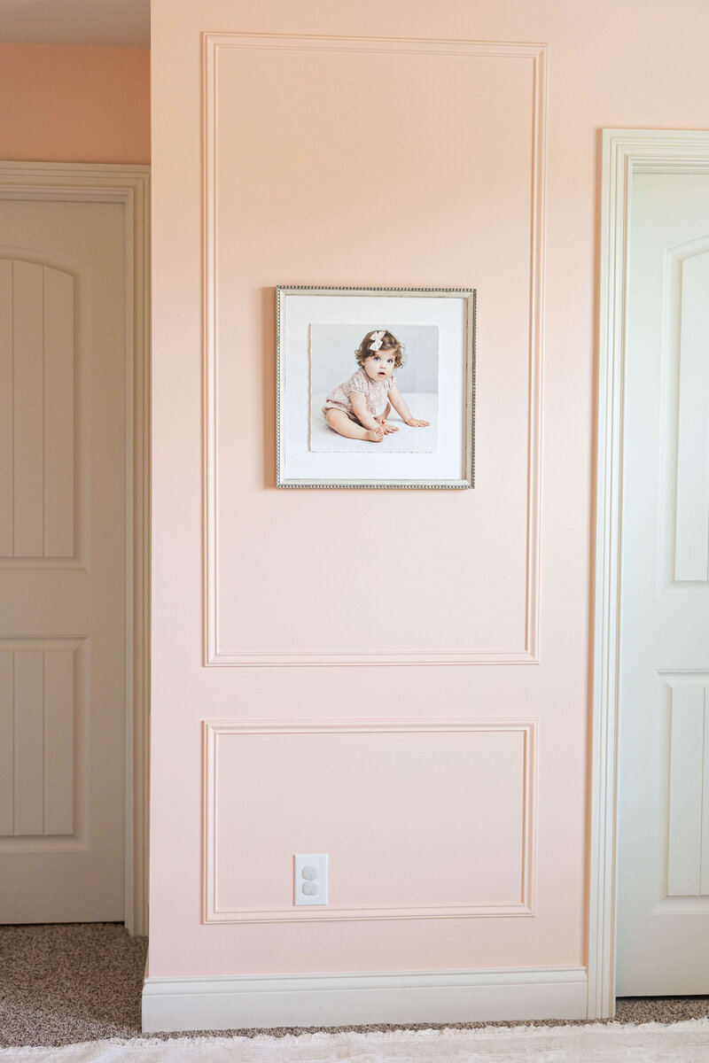deckled edge frame on wall in nursery
