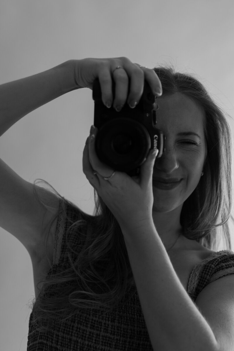 Autumn the wedding photographer, taking a picture with her camera.