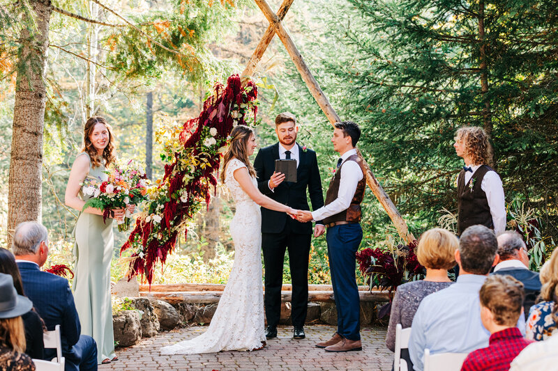 Outdoor wedding ceremony at Izaak Walton Inn in Essex, MT