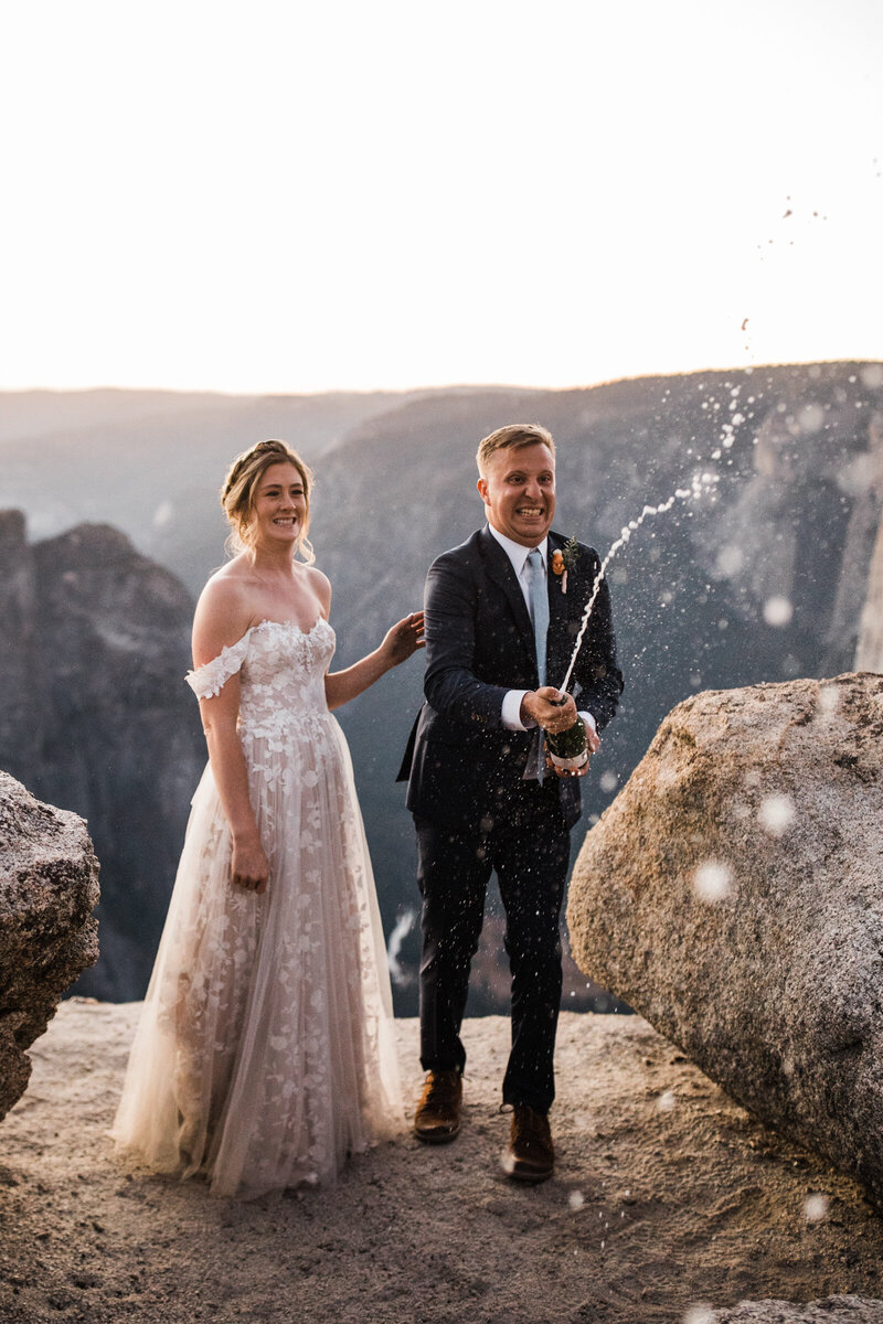 With the mountains behind them the eloping couple shares a dance.