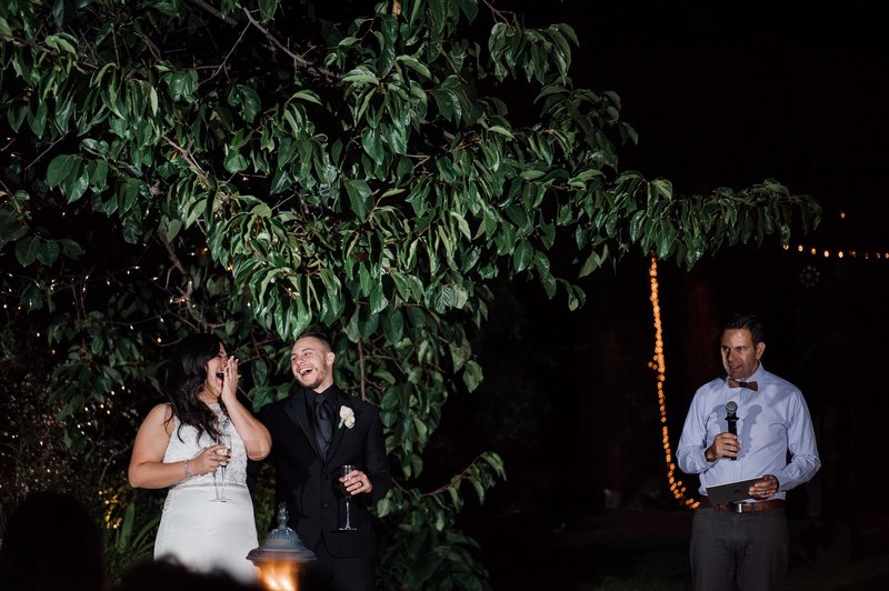 the newlyweds are in stitches over a funny wedding moment