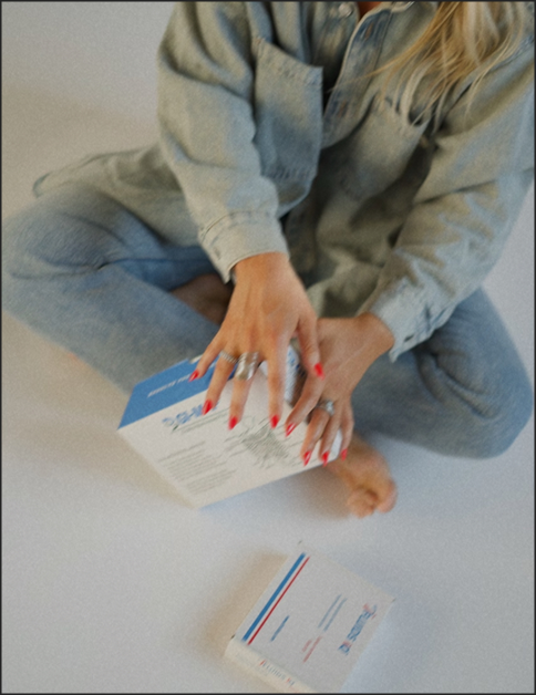 Slight aerial view of Kaylin holding GI Test