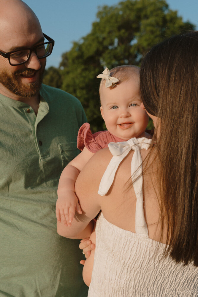 A family of five plays ring around the rosey together at Chestnut Ridge Farm in Limestone, TN