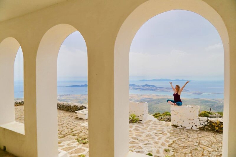 Yoga therapist in quiet contemplation on a Greek island.