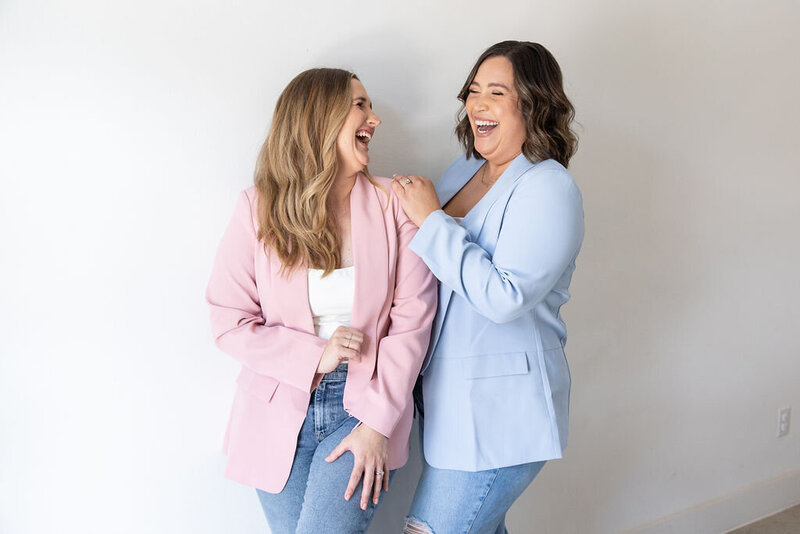 Eventive Designs wedding planners laughing together in pastel blazers, showcasing their approachable, modern planning style in Austin, Texas.