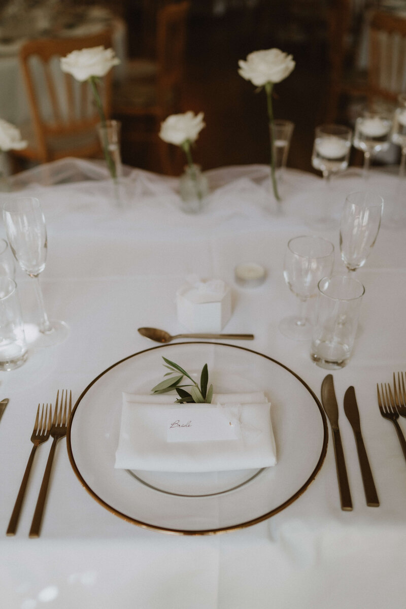 Table set up with a sprig of olive at Brinsop Court
