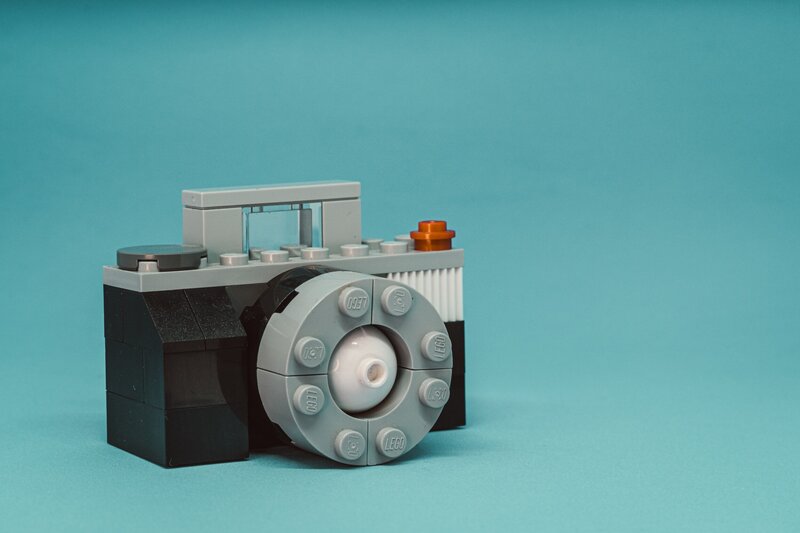 cute lego camera on blue background