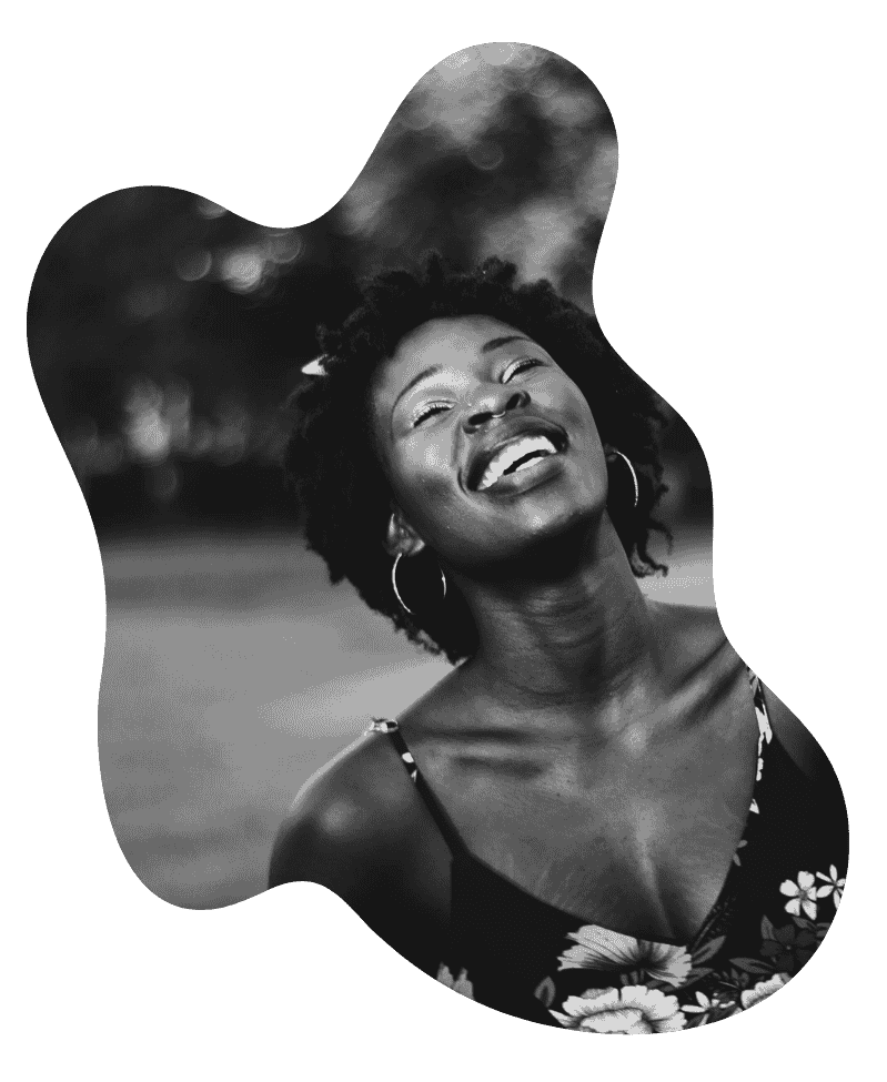 A young black women smiling and  feeling relieved after therapy in Massachusetts 