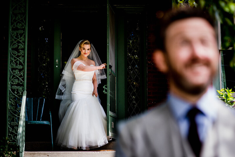 A bride walks out the door to meet her groom at an Evanston backyard wedding.