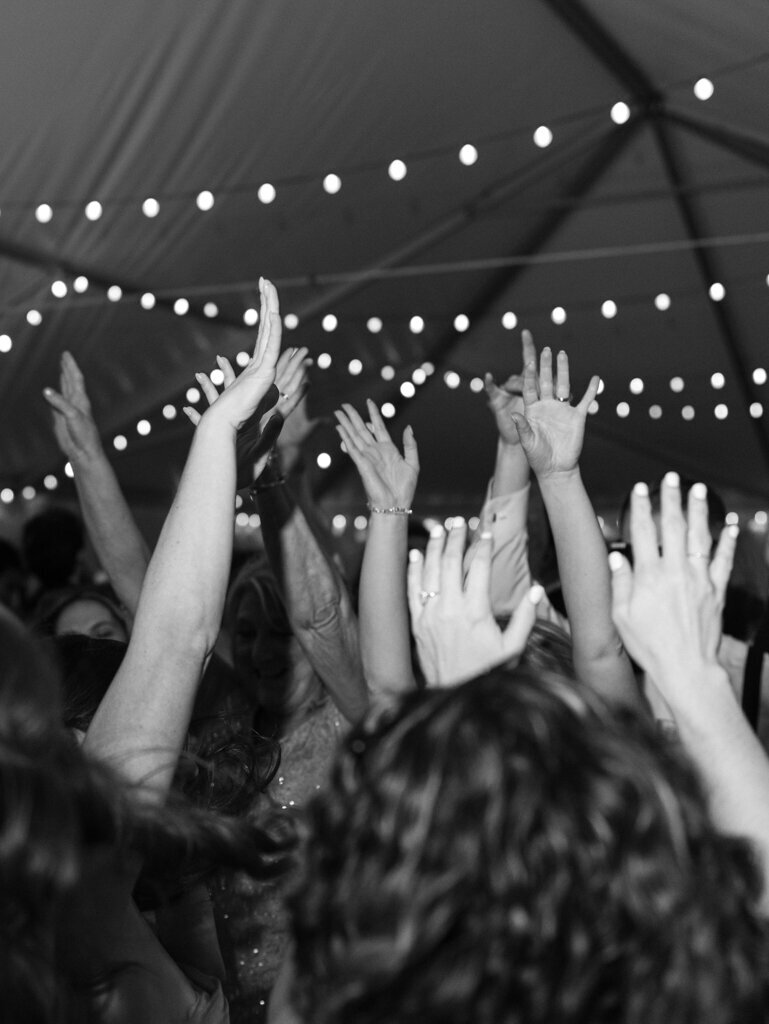 guests hands in the air dancing during wedding reception taken by one of the top baltimore wedding photgraphers