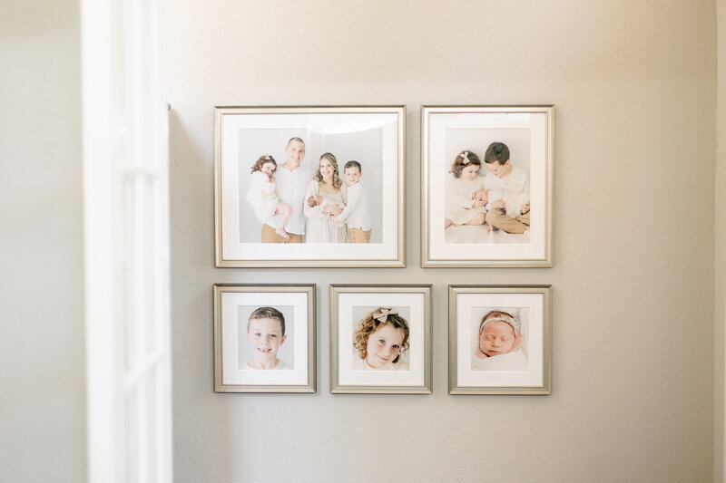 a gallery of framed family photos