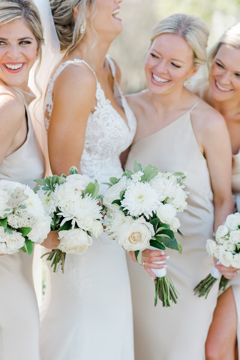 bridesmaids standing with bride at a wedding