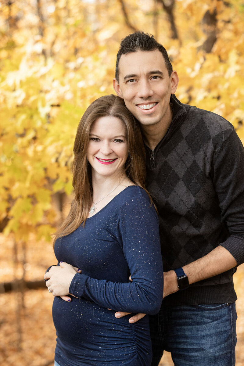Couple having their family portrait in an outdoor setting