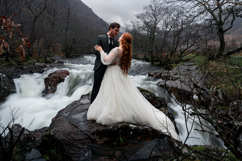 waterfall in glencoe providing backdrop for scotland elopement