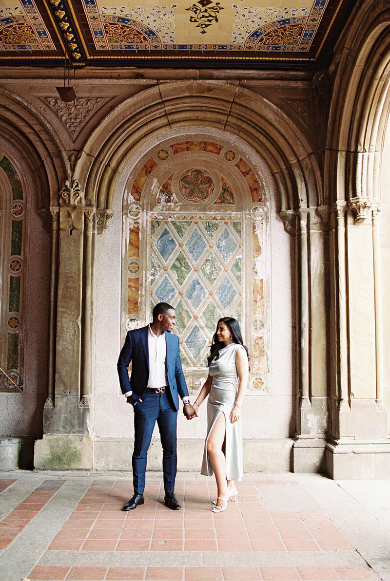 A couple posing in front of beautiful architecture for Texas wedding photographer, Stephanie Michelle