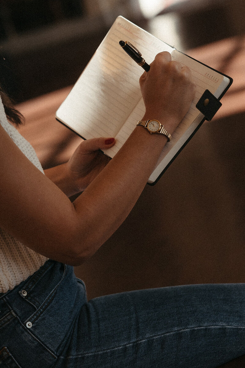 Woman writing in a notebook
