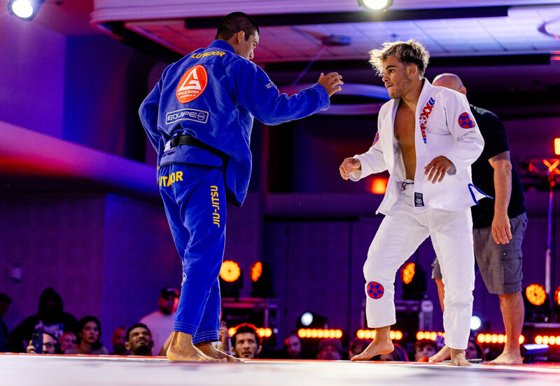 Two black belts bumping hands before grappling at F2W