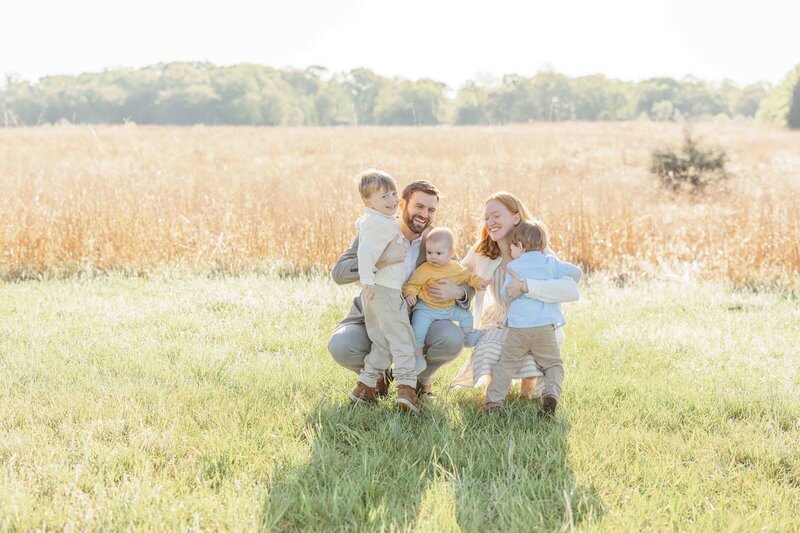 Parents hugging kids taken by photographer in Loudoun County, Virginia