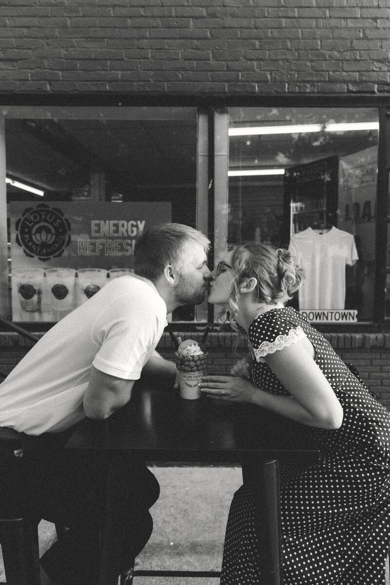 couples maternity photos in tall grass field in michigan